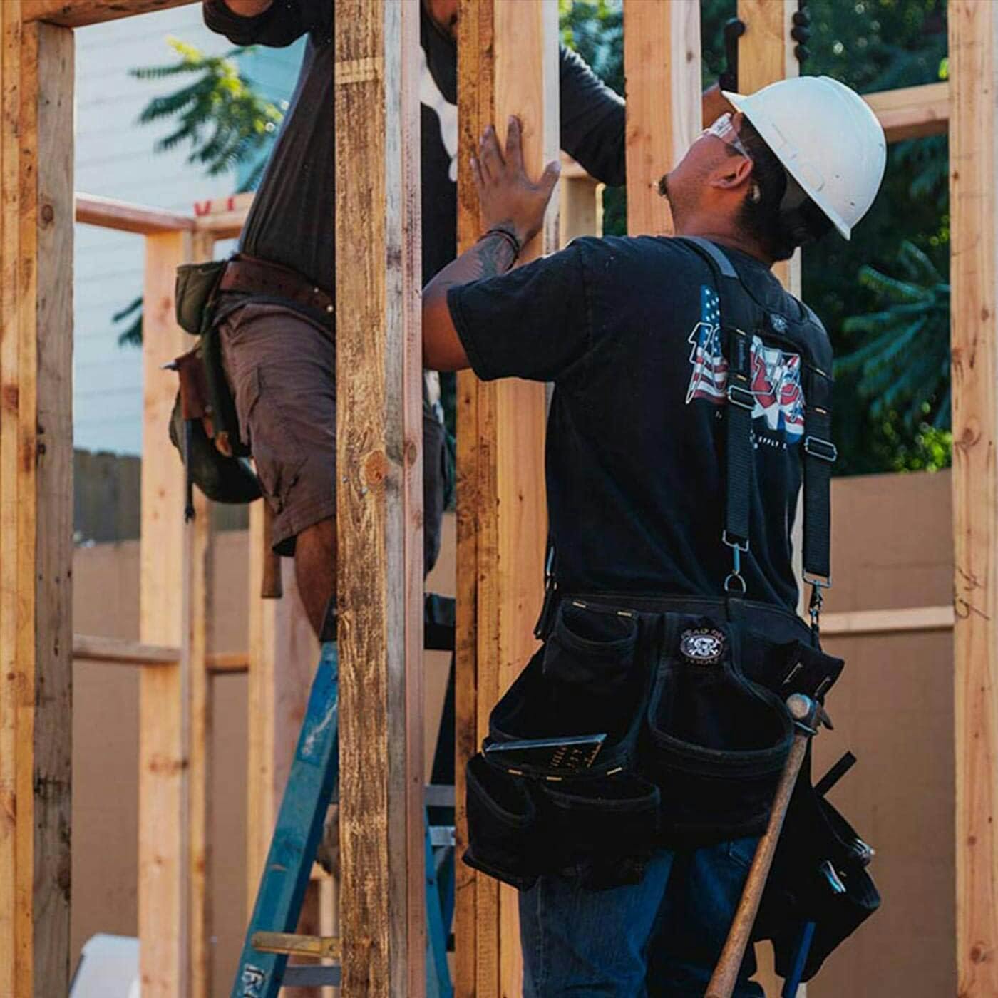 Construction workers framing a building