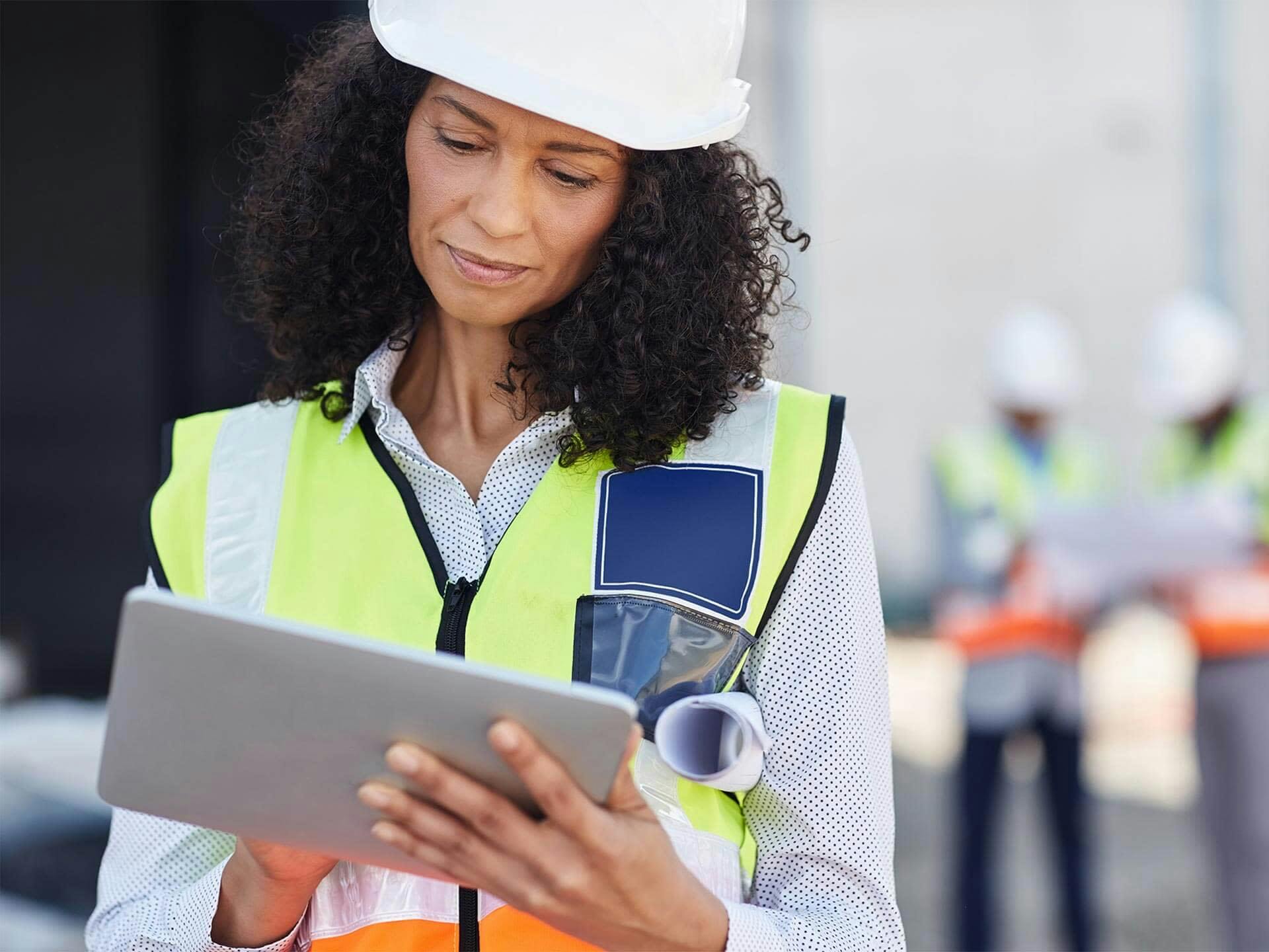 Construction worker using an iPad on a jobsite