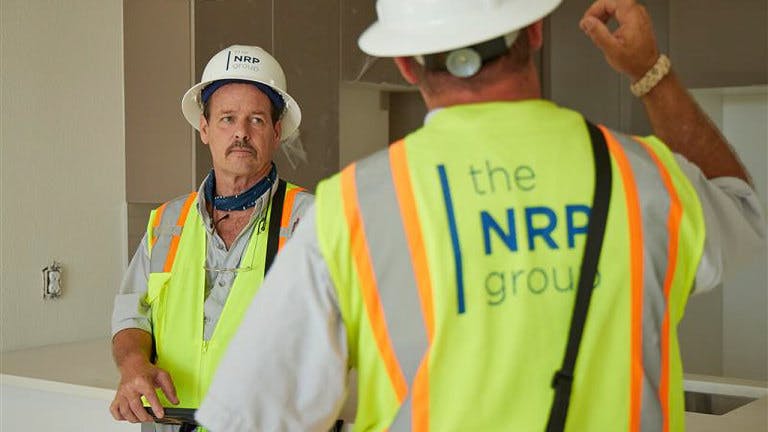 the NRP group construction workers having a conversation