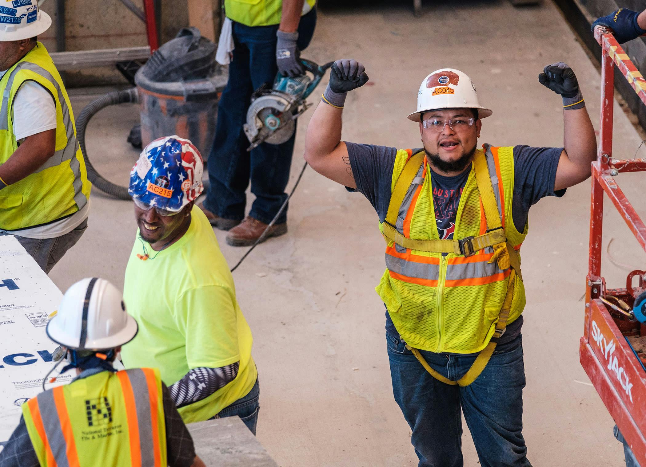 Construction workers celebrating