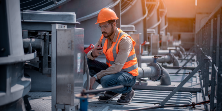 Photo of a worker looking at units during the HVAC estimation process