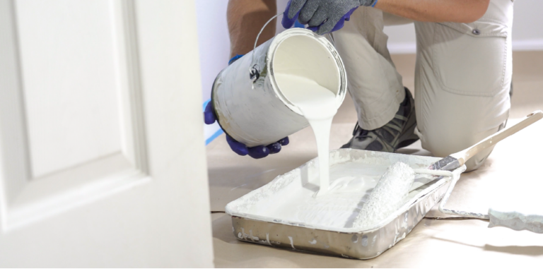 Photo of a contractor pouring paint