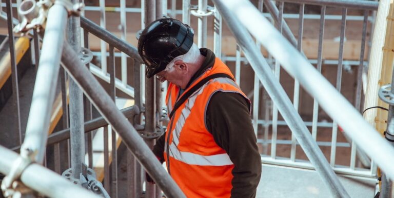 Photo of construction worker on scaffolding