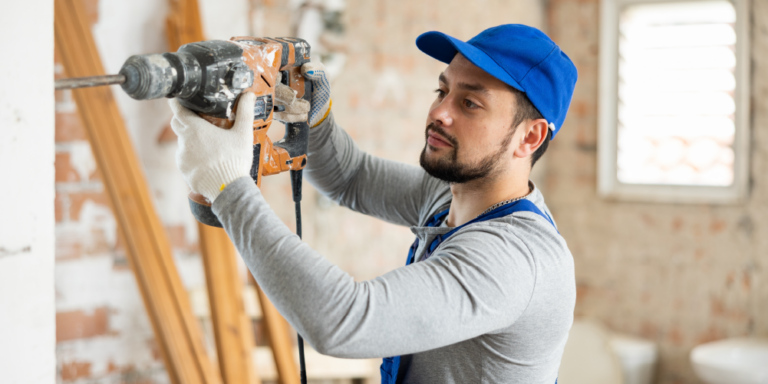 Photo of a contractor with a drill.