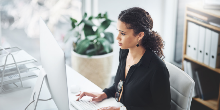 Photo of a woman working at a computer