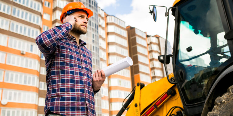 Manager in hard hat on the phone