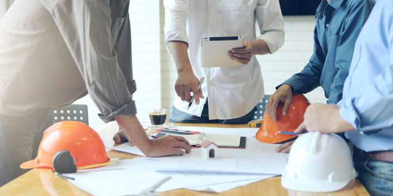 Photo of construction professionals meeting around a table