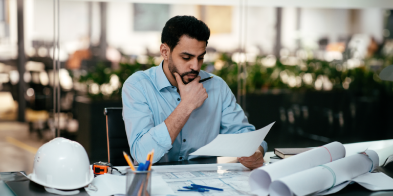 Photo of person reviewing documents at a desk