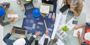 A construction design team reviews designs for a project.