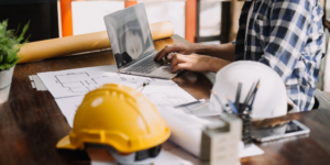 Photo of construction company office worker at a desk