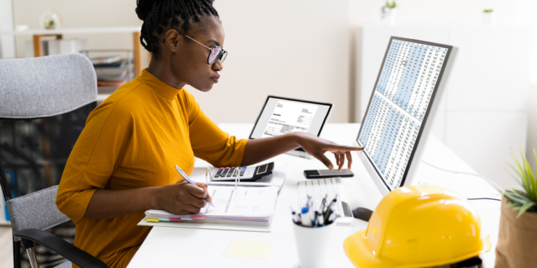 Woman at a laptop conduction a construction audit.