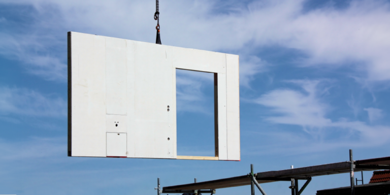A piece of wall being assembled as part of a prefab construction project.