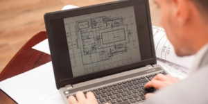 Project as-built drawings displayed on a laptop.