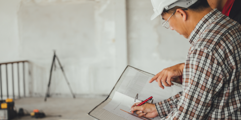 Construction administrator examining a document