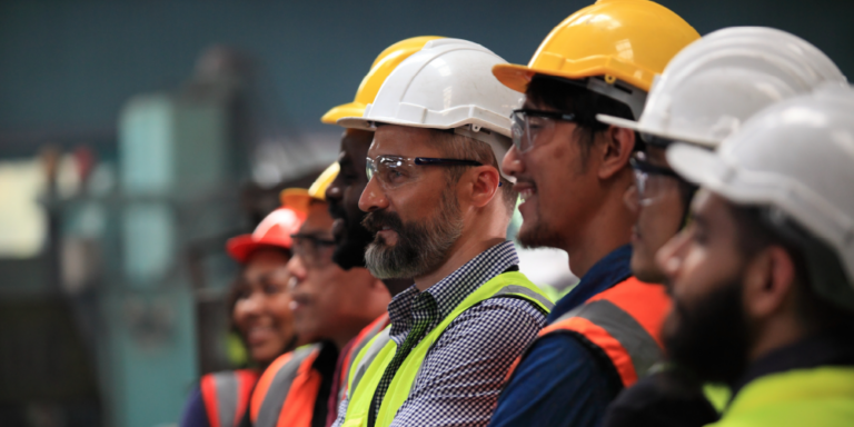 Side photo of a construction team looking to the left