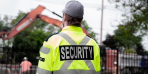 Photo of a construction jobsite security guard looking over a site.