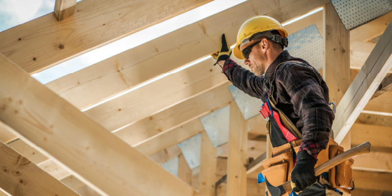 Photo of subtractor inspecting lumber beams