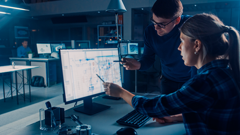 2 workers looking at an AI generated computer model
