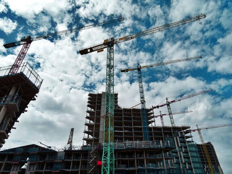 Green and yellow crane on construction site