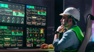 Construction data admin surrounded by computers