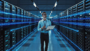 Construction professional inspecting data center server room