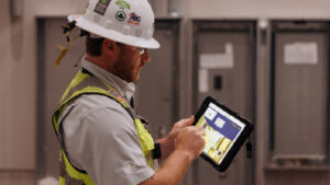 Construction pro reviewing a 3D model on a tablet
