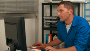 MEP contractor working at a computer