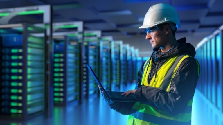 Construction engineer with PPE working inside a data center