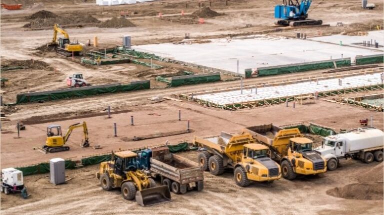 Construction fleet management aerial photo of trucks