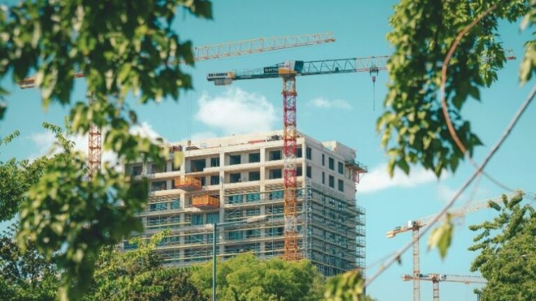 Photo of a crane on a building still under construction