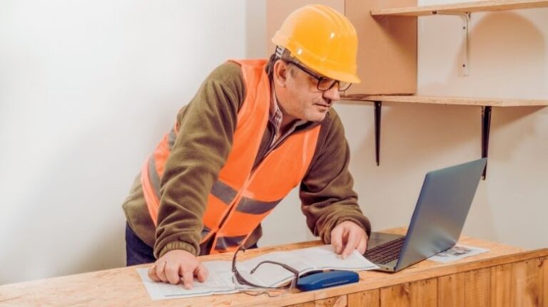 Contractor looking at a laptop