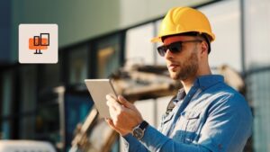 Construction field worker looking at tablet in the field