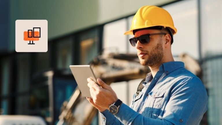 Construction field worker looking at tablet in the field