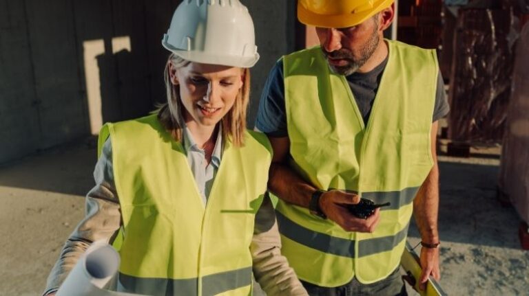 Two workers on a jobsite