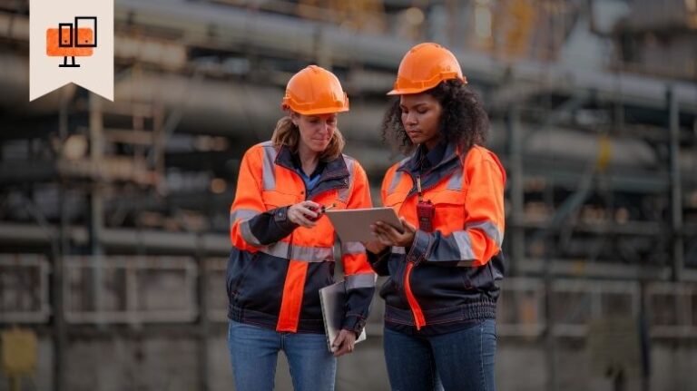 Two engineers looking at a tablet