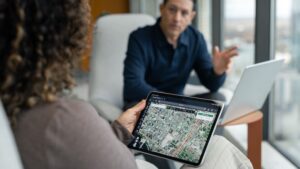 Owners looking at analytics on a tablet in an office