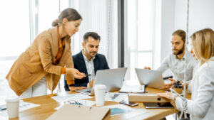 Construction executives working in a conference room together